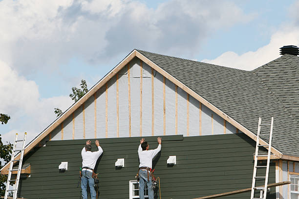 Professional Storm Damage Siding Repair technician working in Tyrone, PA